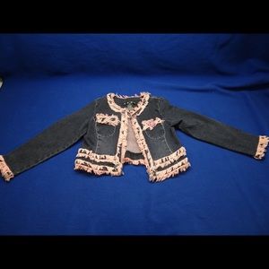 Girls denim jacket with fringe detail.