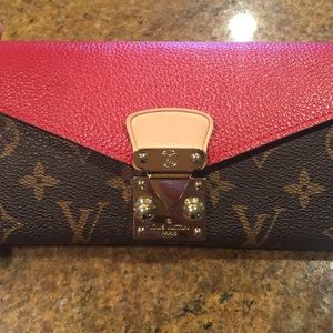 Brown red LV wallet. Only used once.