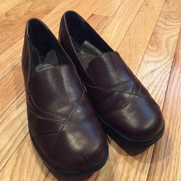 Brown Clarks leather slip ons