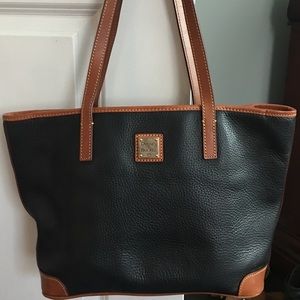Black and brown leather bag with pink inside