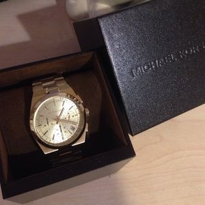 Gold Michael Kors watch.
