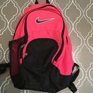 Pink and black Nike backpack