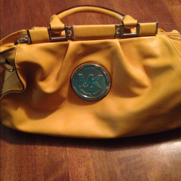 MK yellow and grey purse.