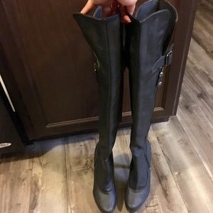 Matte black thigh high heeled boots