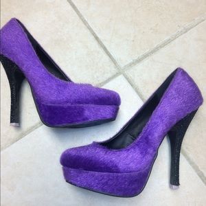 Purple "fuzzy" stilettos w/ black sparkly heel.