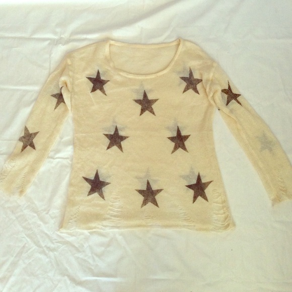Distressed knit star print sweater