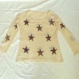 Distressed knit star print sweater