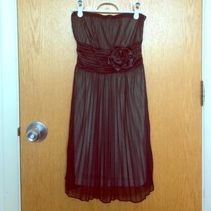 Strapless black cocktail dress with large rose