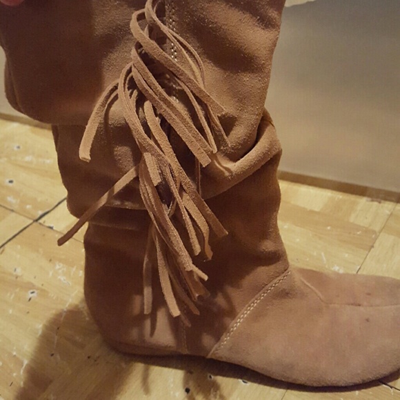 Tall tan boots with fringe