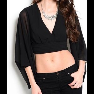 Black midriff top. 100% Polyester.  Made in China