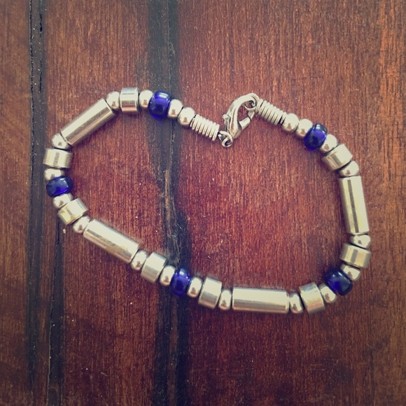 Silverish and blue beaded bracelet.