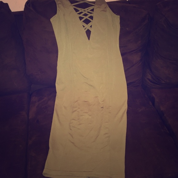 A dark green spandex revealing dress,