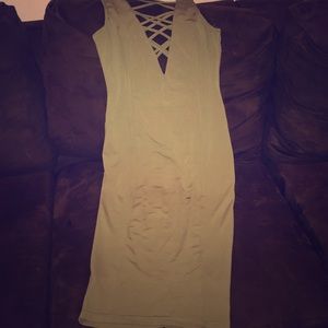 A dark green spandex revealing dress,
