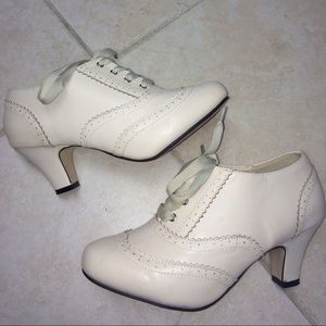 Oxford inspired lace up cream heels by Modcloth!