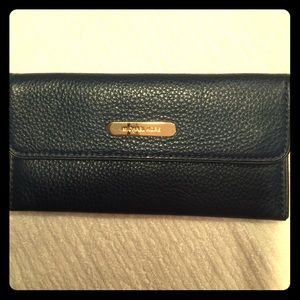 Michael Kors womens ,navy blue leather wallet.