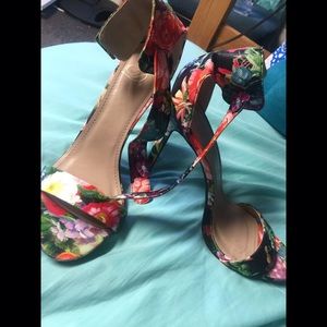 Colorful flowered high heels .