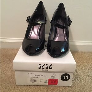 BCBG Black patent leather peep-toe heels.