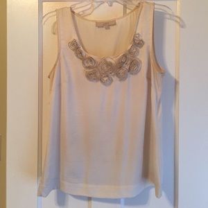 Cream sleeveless blouse