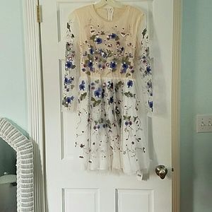Embroidered white A-line dress with flowers