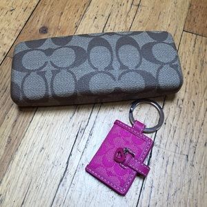 Coach reading glasses with case and keychain.
