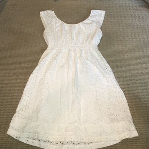 White sleeveless eyelet dress