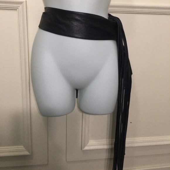 Black leather tassel belt.