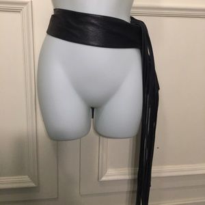 Black leather tassel belt.