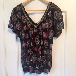American Rag patterned v-neck top.