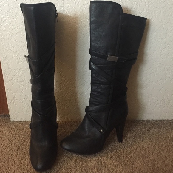 Strapped black heeled boots