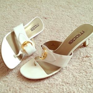Miss Spana white kitten heel, thong w/gold buckle