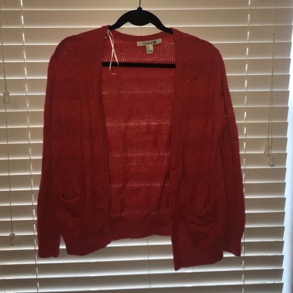 orange cardigan.