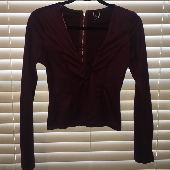 burgundy cut out shirt.