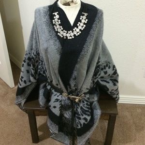 Black and gray animal print square poncho wrap.