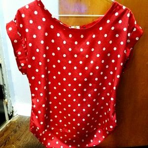 Red with white and navy polka dot high low blouse
