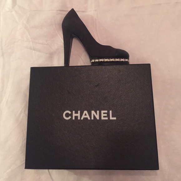 Gorgeous Chanel black sued with leather tip.