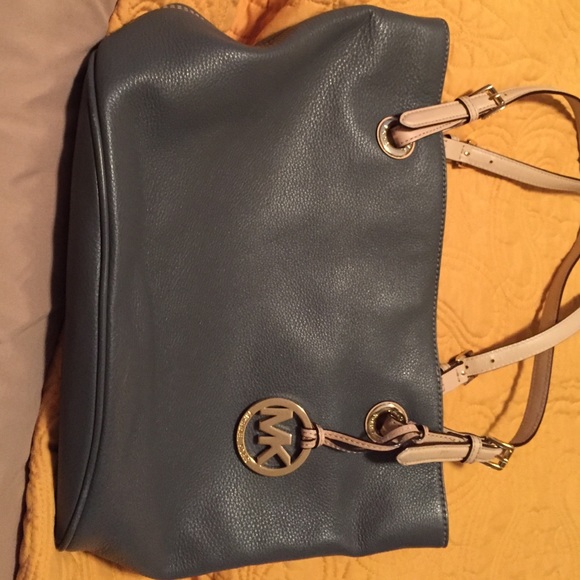 Like new.  Used only 1time. MK Gray leather