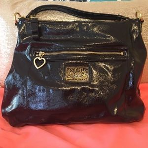 Black Coach Purse with gold detail on front.