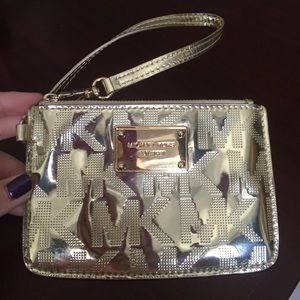 MK metallic gold wristlet