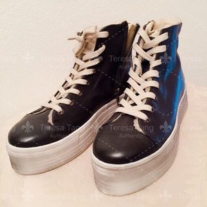 Dark grey Steve Madden high top sneakers.