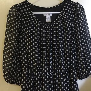 Black dress with white polka dots.