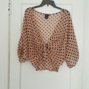 Pink and black polka dotted blouse