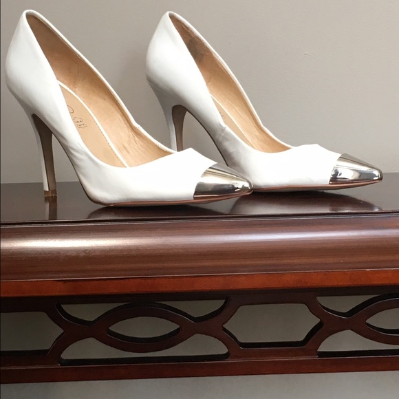 EUC White, silver capped ALDO pumps.