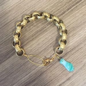 Metal chain bracelet with glass hand charm