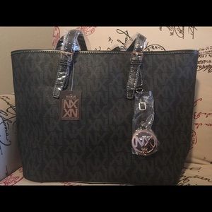 Noble Exchange - black monogram bag.
