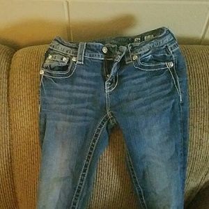 Boot cut mid rise miss me jeans