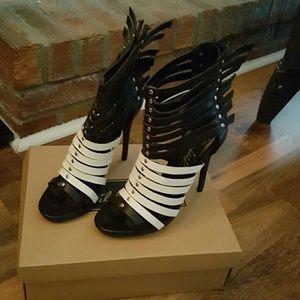Black and white caged heel with wings