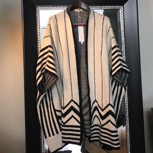 Open front poncho style sweater. Black and white.