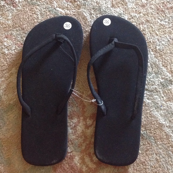 Shoes - Black flip flops and leopard flip flops.