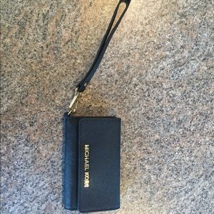 Michael Kors wristlet...hold iPhone 5