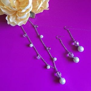 Faux pearl necklace and earrings set.